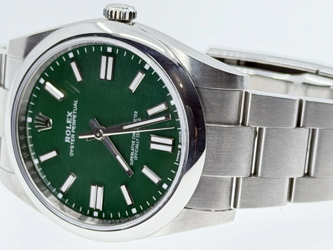 Rolex Oyster Perpetual 41 with Green Dial model 124300 Box Papers Card